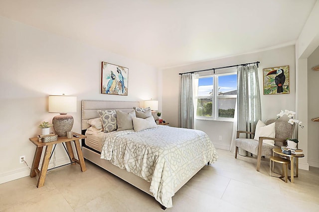 bedroom with light tile patterned flooring