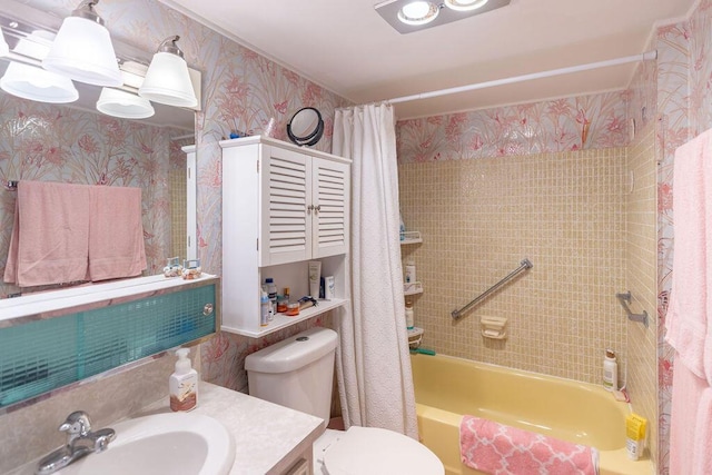 full bathroom featuring vanity, shower / tub combo, and toilet