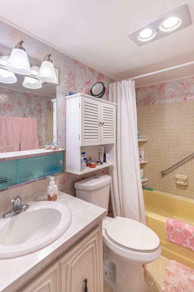 full bathroom featuring shower / tub combo, vanity, and toilet