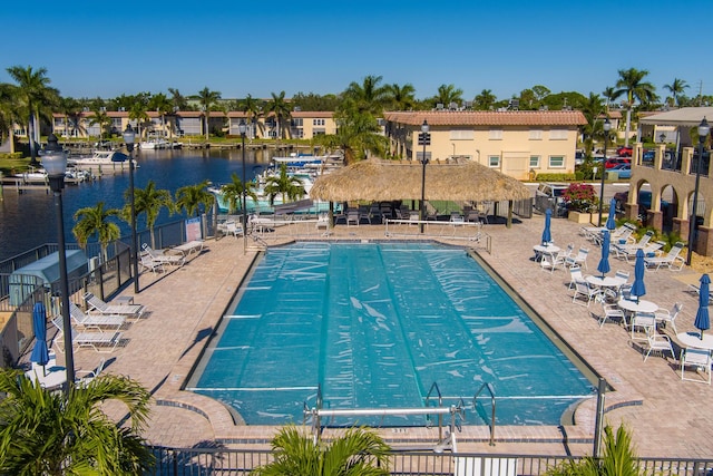 view of swimming pool with a water view