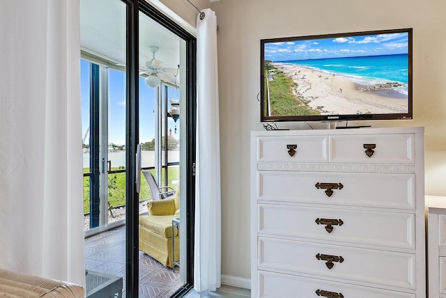 doorway featuring plenty of natural light and ceiling fan