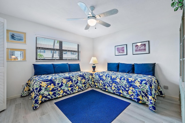 bedroom featuring hardwood / wood-style flooring and ceiling fan