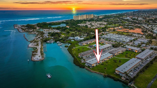 aerial view at dusk with a water view