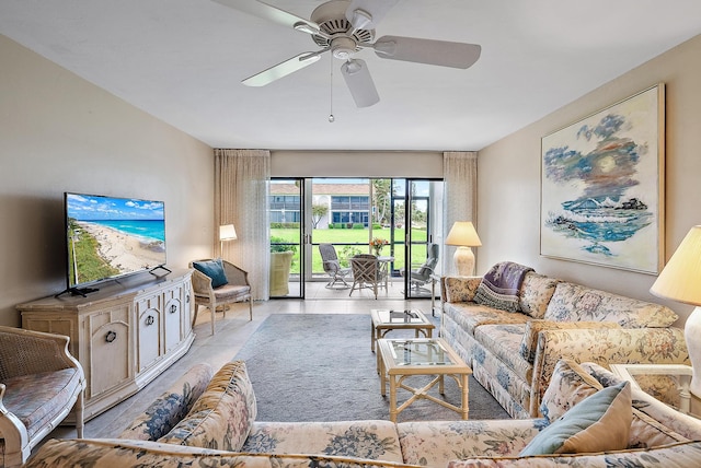 tiled living room featuring ceiling fan