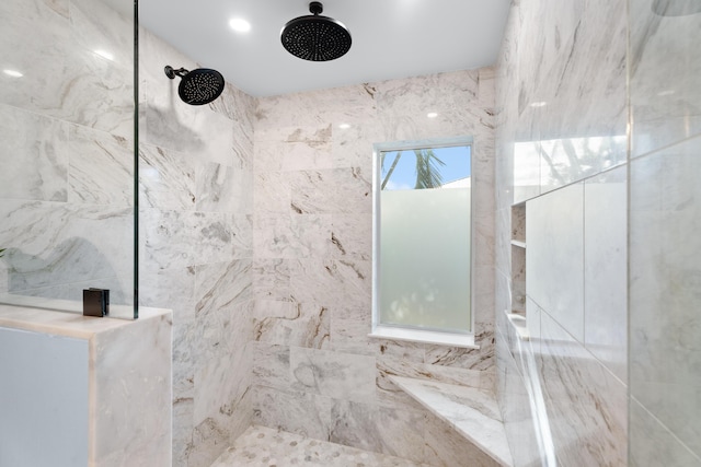 bathroom featuring tiled shower