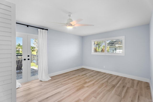 unfurnished room featuring french doors, ceiling fan, and light wood-type flooring