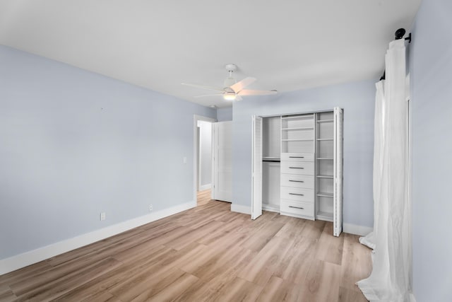 unfurnished bedroom with ceiling fan, a closet, and light hardwood / wood-style flooring