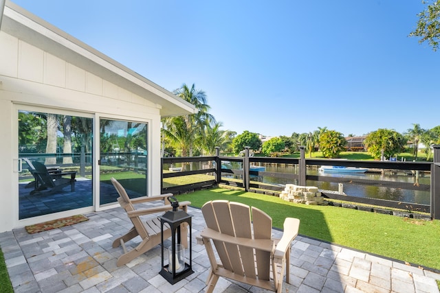 view of patio with a water view