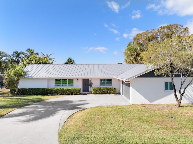 single story home with a garage and a front yard