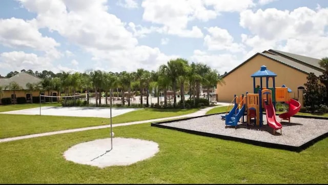 view of play area with volleyball court and a yard