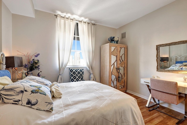 bedroom featuring wood-type flooring