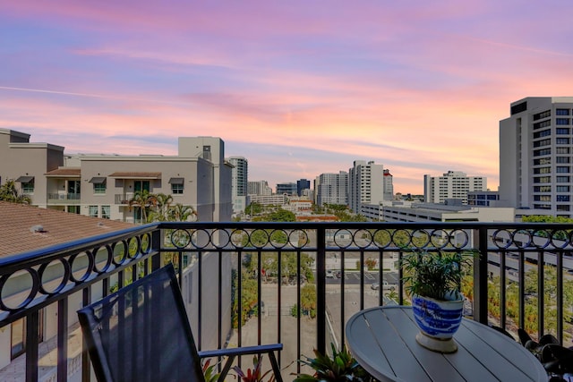 view of balcony at dusk