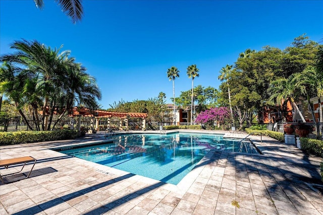 view of pool with a pergola and a patio area