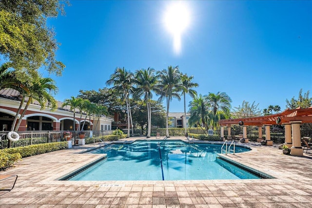 view of swimming pool with a pergola and a patio area