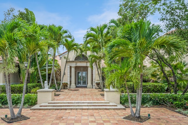 view of exterior entry featuring french doors