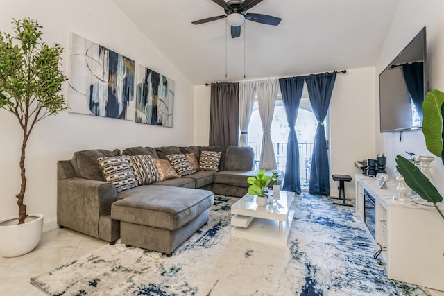 living room with light tile patterned floors, a textured ceiling, vaulted ceiling, and ceiling fan