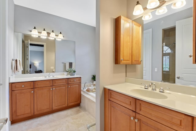 bathroom featuring shower with separate bathtub and vanity