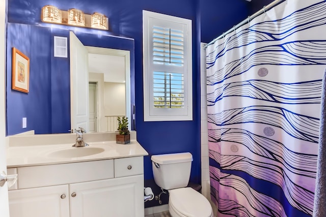 bathroom with vanity and toilet