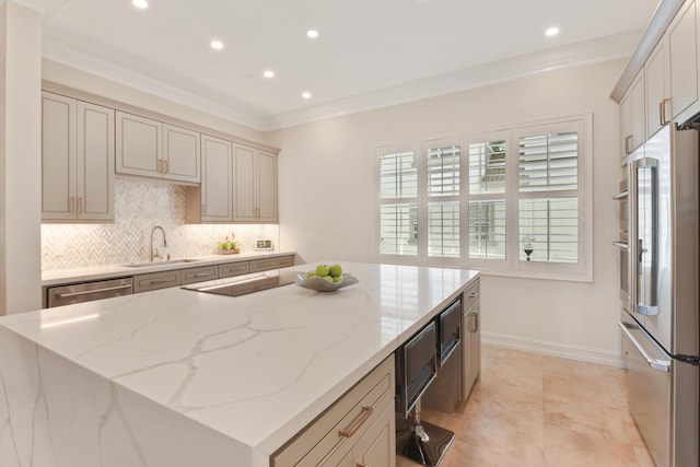 kitchen featuring a center island, light stone countertops, sink, and appliances with stainless steel finishes