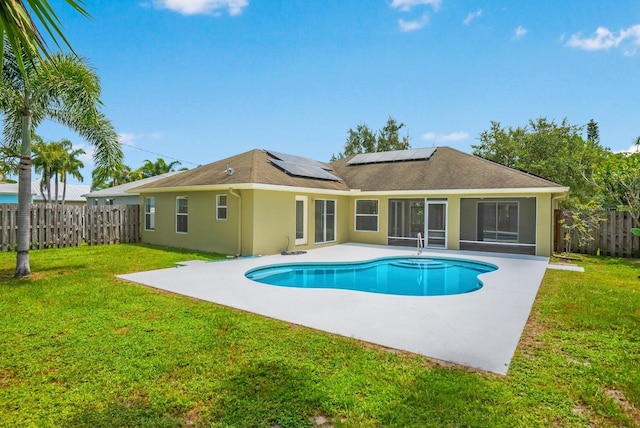 view of pool featuring a yard and a patio