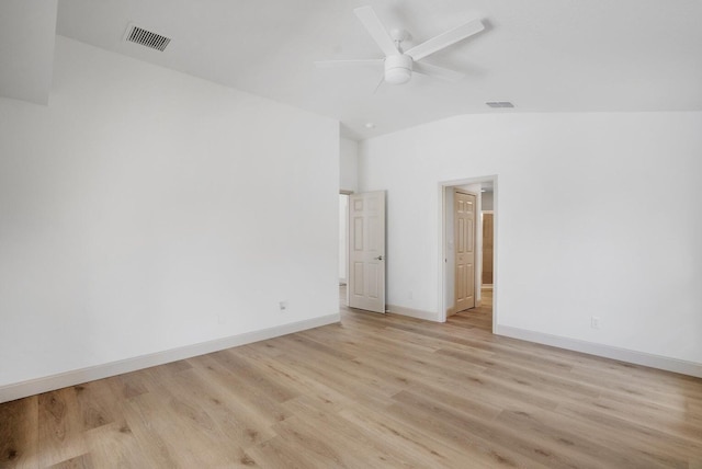 empty room featuring light hardwood / wood-style floors, ceiling fan, and lofted ceiling