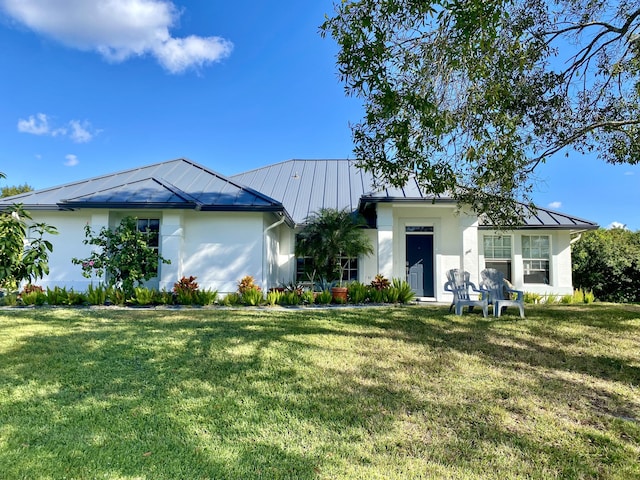 single story home featuring a front lawn