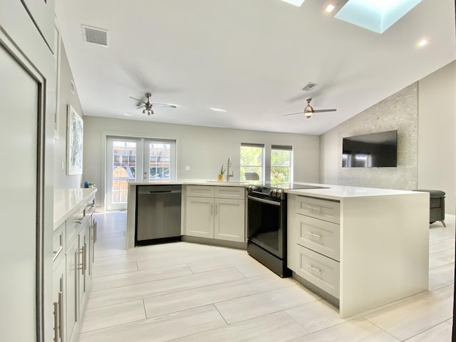 kitchen featuring electric range, ceiling fan, stainless steel dishwasher, and a kitchen island