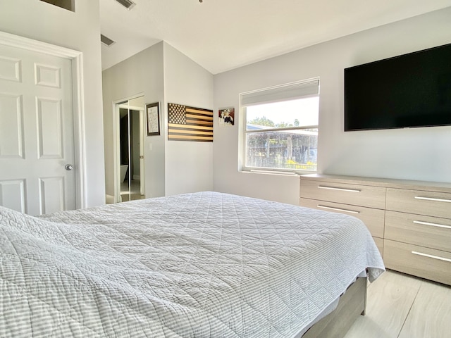 bedroom with a closet and light wood-type flooring