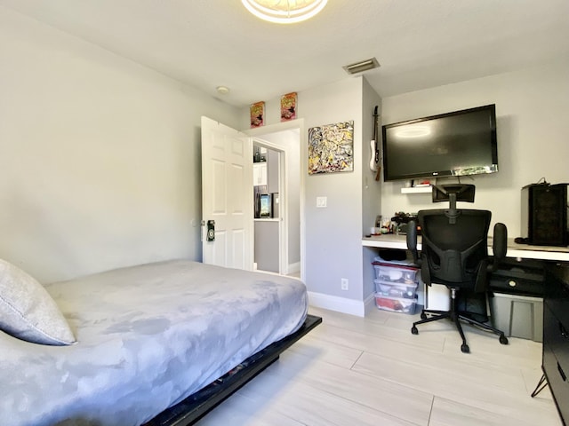 bedroom featuring light wood-type flooring