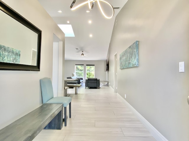 corridor with light hardwood / wood-style flooring