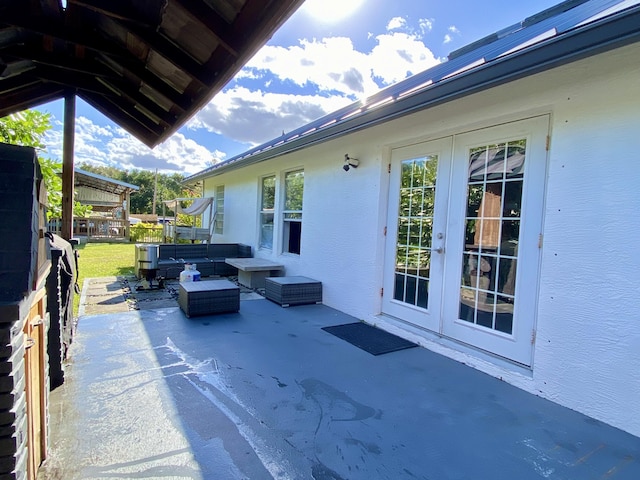 view of patio featuring outdoor lounge area and french doors