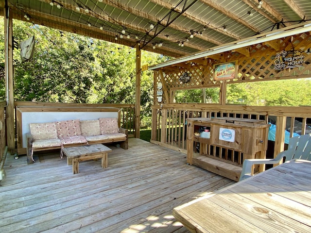 wooden terrace with outdoor lounge area