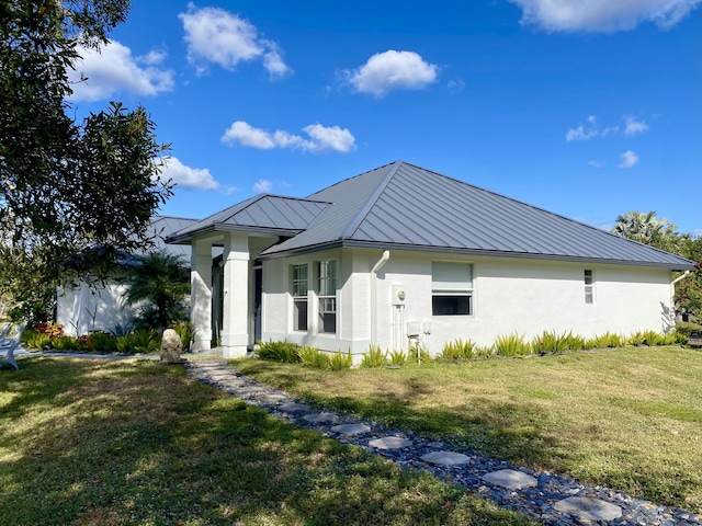 view of property exterior with a yard