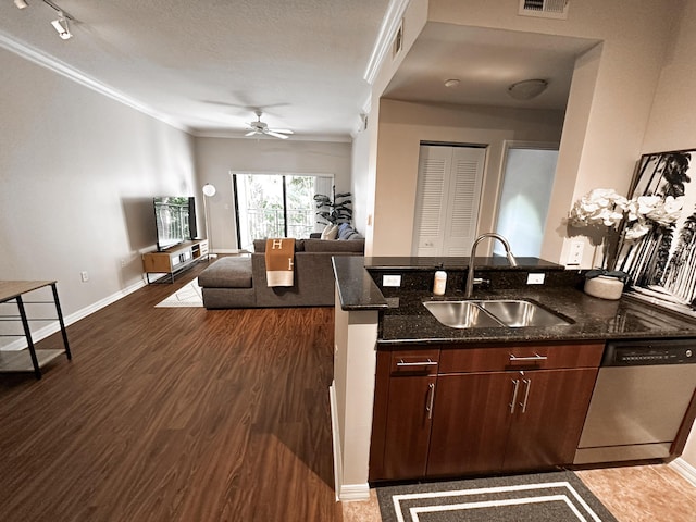 kitchen featuring sink, stainless steel dishwasher, dark stone countertops, wood-type flooring, and ornamental molding