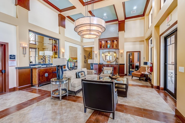 living room featuring beamed ceiling, a towering ceiling, crown molding, and coffered ceiling