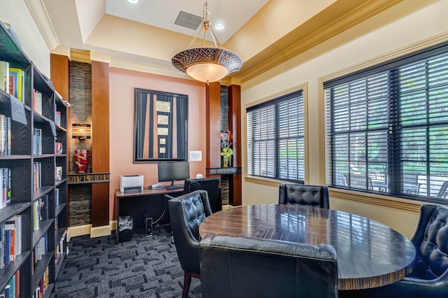 office area with a tray ceiling and ornamental molding