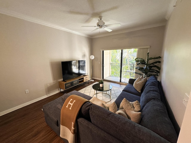 living room featuring ceiling fan, ornamental molding, and hardwood / wood-style flooring