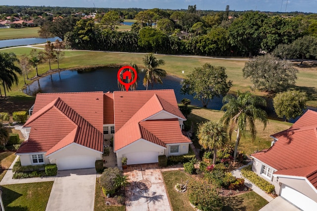 drone / aerial view with a water view