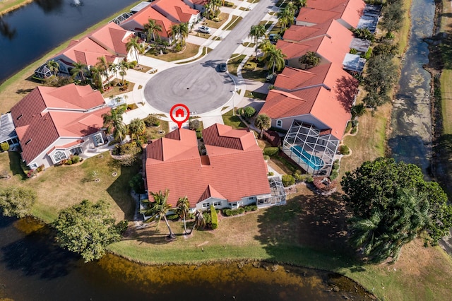 birds eye view of property featuring a water view