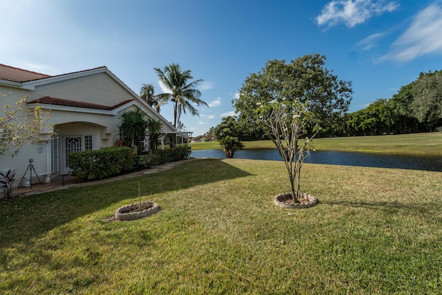 view of yard with a water view