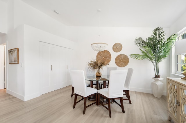 dining space with light hardwood / wood-style flooring