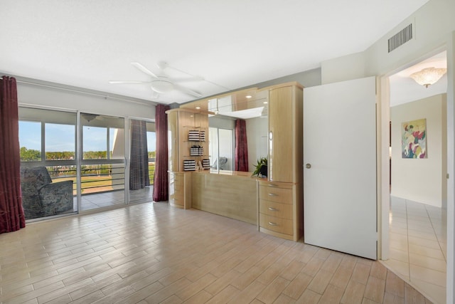 empty room featuring light hardwood / wood-style floors and ceiling fan