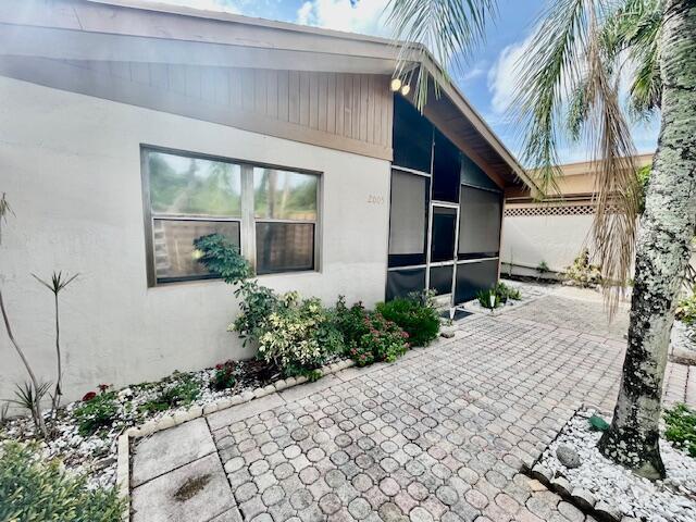 view of property exterior featuring a patio