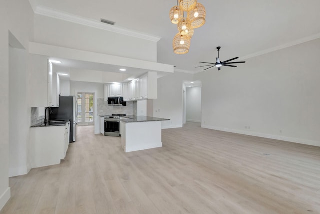 kitchen featuring white cabinetry, stainless steel appliances, crown molding, pendant lighting, and light hardwood / wood-style floors