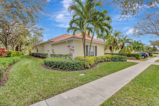 view of property exterior with a yard