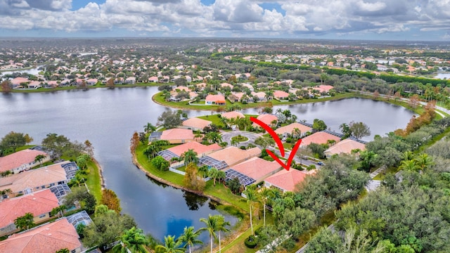 birds eye view of property featuring a water view