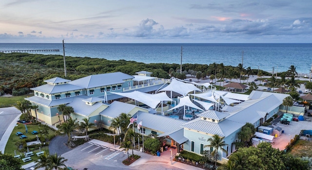 aerial view at dusk with a water view