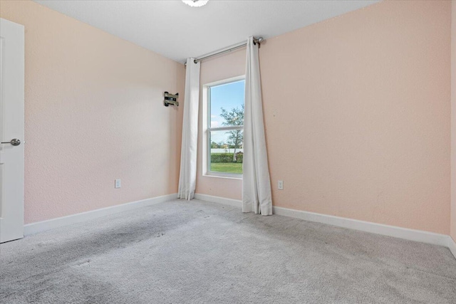 empty room featuring light colored carpet