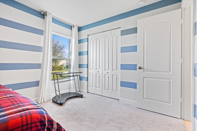 bedroom featuring a closet and carpet