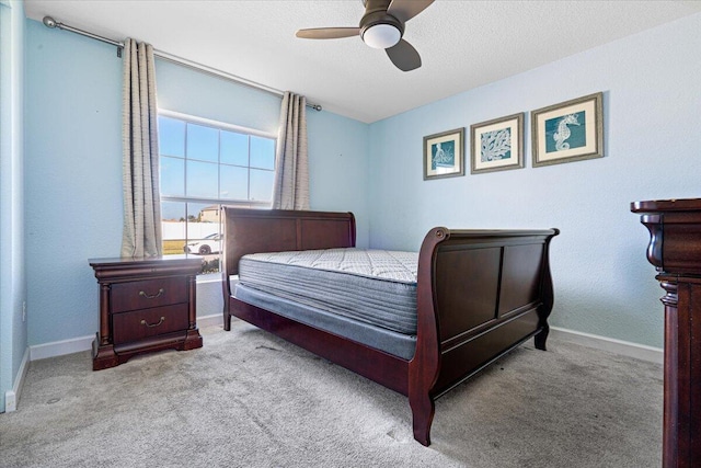 bedroom featuring light carpet and ceiling fan